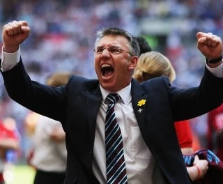  What a difference seven weeks makes: After losing to Luton in the Johnstone's Paint Trophy final seven weeks earlier, Adkins guides Scunthorpe to League 1 play off victory and a place in the Championship for the 2009/2010 season 