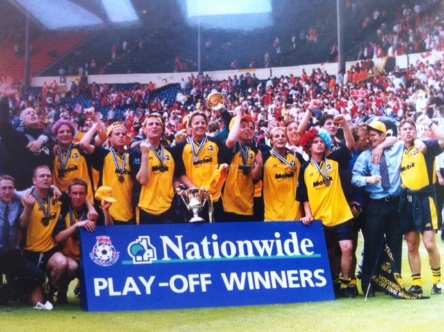  Up we go: Scunthorpe players celebrate beating Leyton Orient 1-0 in the League 2 play-off finals at the old Wembley stadium 