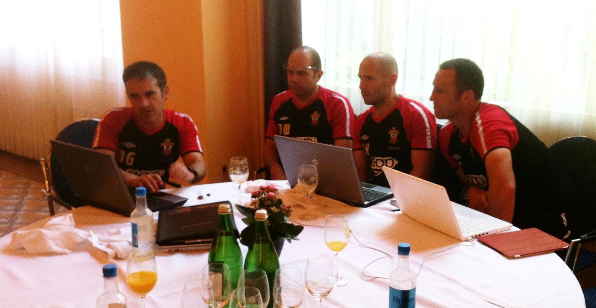 Left to right. Mo Gimpel Head of Medicine and Sport Science. Dean Wilkins 1st Team Coach.&nbsp;Nick Harvey 1st Team Head of Sport Science. Andy Crosby Assistant Manager.  Collaboration. Discussing the players daily morning wellness scores during Southampton's 2011 pre-season tour to Interlaken in Switzerland.