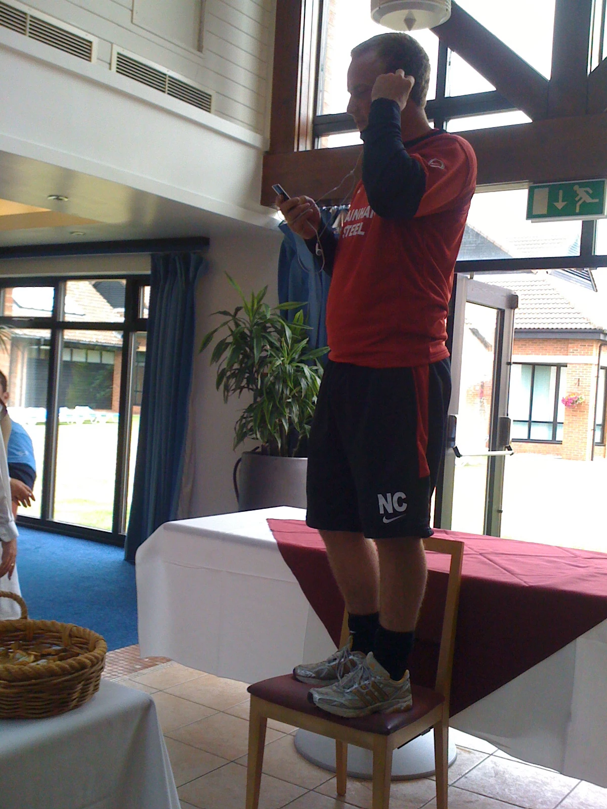 Newly appointed Kitman Nick Crawford preparing to do his initiation song during Scunthorpe United pre-season training camp for the Championship Season at Champney Springs in Leicestershire July 2010.